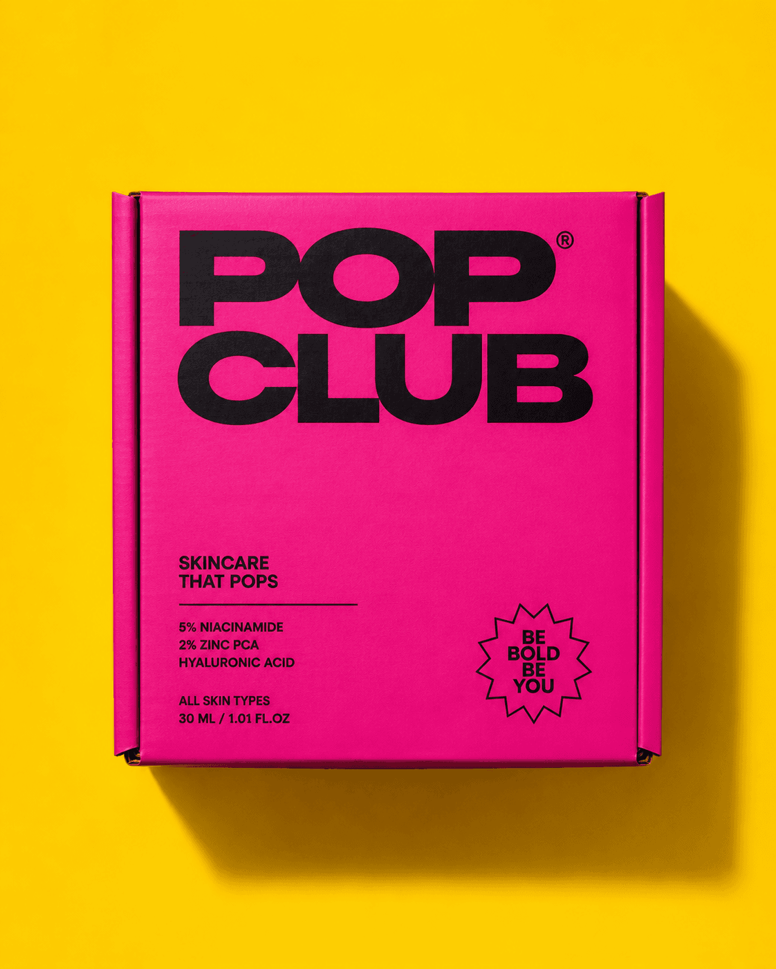 Pop Club pink skincare box on yellow background